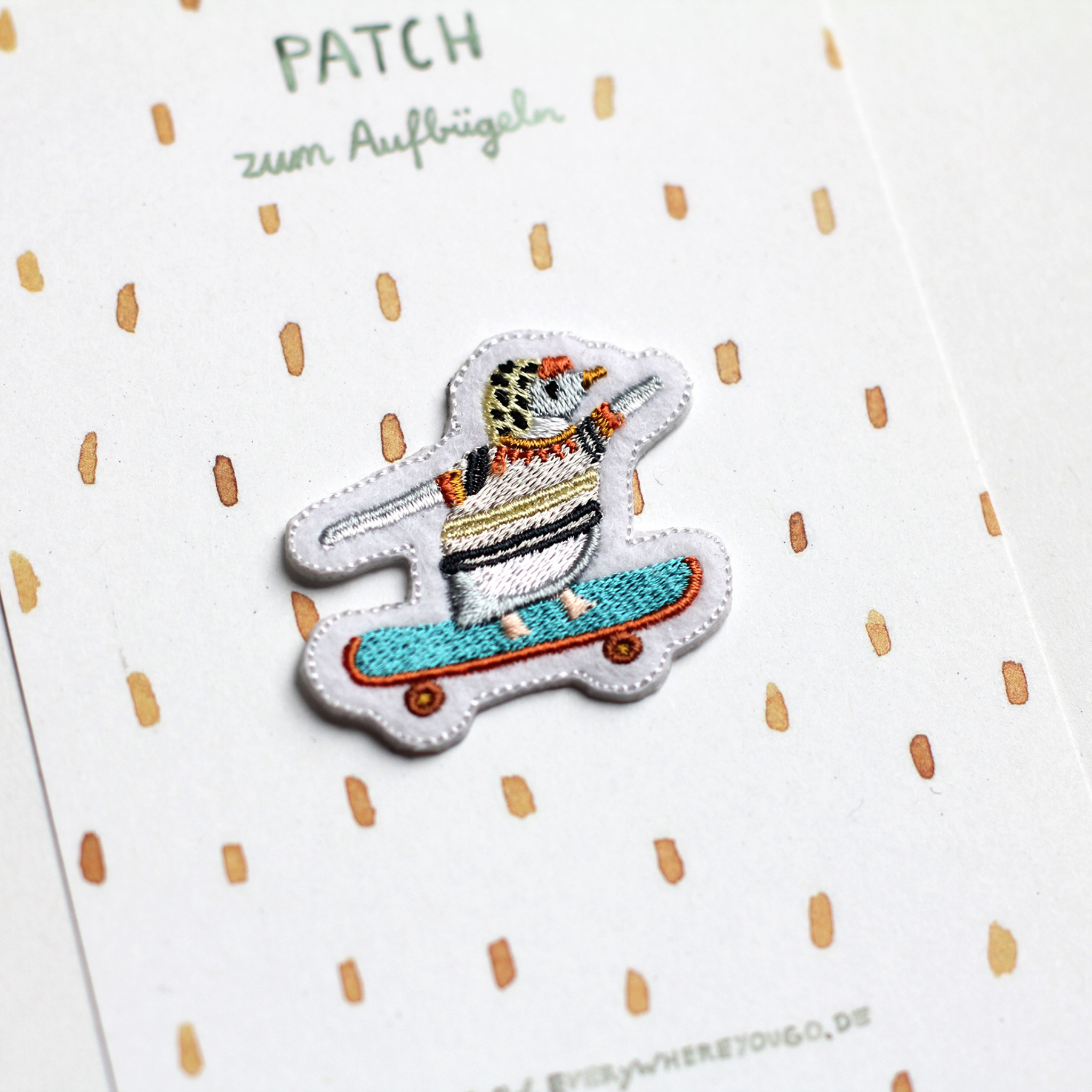 Aufnäher Pinguin auf dem Skateboard